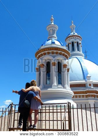Cuenca, Ecuador - May 11, 2019: Young Couple Hugging On The Observation Deck Of New Cathedral Or Cat