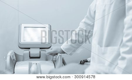 Woman During Procedure Of Facial Skin Microdermabrasion In Beauty Salon Black White Image With A Blu