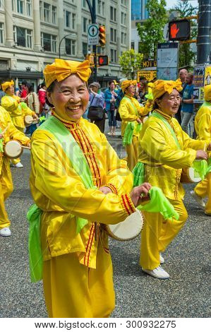 May 12, 2019 - Vancouver, Canada: Falun Dafa Members In Parade Through Streets Of Downtown On Mother