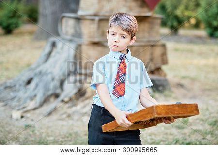Boy With Large Abacus. Thoughtful Schoolboy Using A Maths Abacus Calculation.