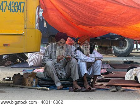 New Delhi, India - December 2020
Portrait Of A Two Farmers Sitting At Protest Site,they Are Protesti