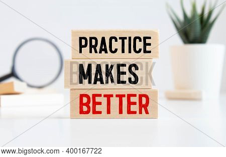 Practice Makes Better Text Written On A Notebook With Pencils.
