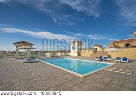 Large Rooftop Swimming Pool At A Luxury Tropical Hotel Resort