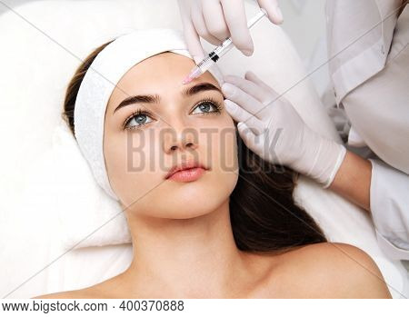 Woman Getting Cosmetic. Injection. Beauty Injections And Cosmetology.  Young Woman In Beauty Salon S