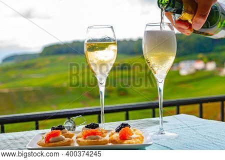 Tasting Of French Sparkling White Wine With Bubbles Champagne On Outdoor Terrace With View On Grand