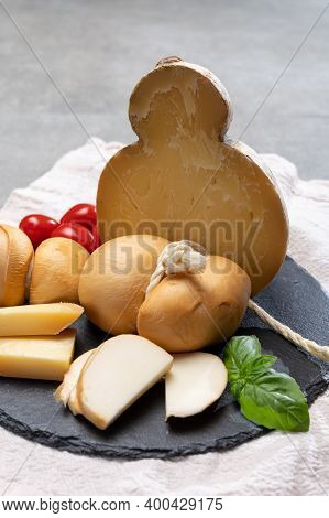 Italian Semi Hard Handmade Smoked Scamorza And Caciocavallo Matured In Caves Cheeses Made From Cow M