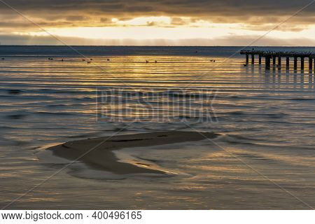 A Sand Bar With A Beautiful Ocean Sunset In The Background. Photo From Hallevik, Blekinge County, Sw