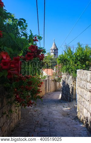 Narrow Pebble Street In Cavtat. Blue Sky