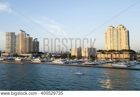 The Motorboat Passing By Miami Beach Marina During The Sunset (florida).