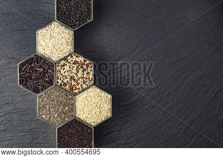 Various Cereals And Grains In The Hexagonal Shaped Honeycomb Jars