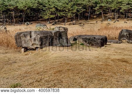 Large Boulders Used As Capstone On Dolmen Burial Chamber In Neolithic Park.