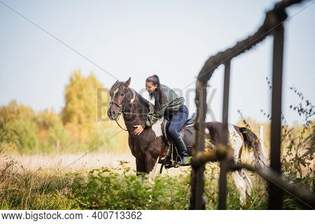 On A Warm Autumn Day, A Young Girl Went Out To Ride Her Mare On Horseback Around The Farm.