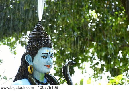 Statue Of Lord Shiva And Background Raining