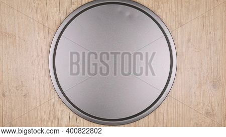 Iron Empty Tray Top View On A Wooden Table. High Quality Photo