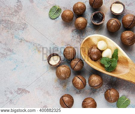 Organic Macadamia Nuts On A Grey Concrete