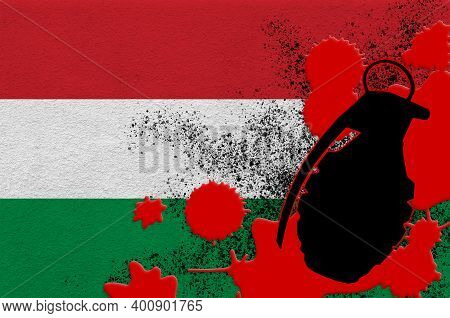 Hungary Flag And Mk2 Frag Grenade In Red Blood. Concept For Terror Attack Or Military Operations Wit