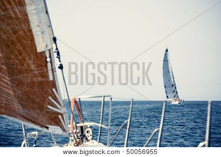 Sailing ship yachts with white sails