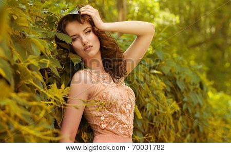 Beautiful woman in spring garden