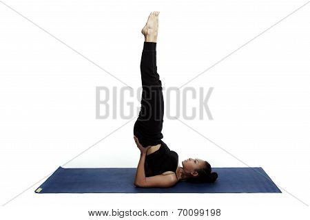 Young Beautiful Yoga Posing On A White Studio Background.