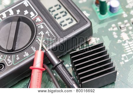 Close-up Multimeter On Pcb Plate.
