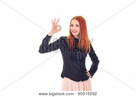 Happy successful redhead woman showing OK sign