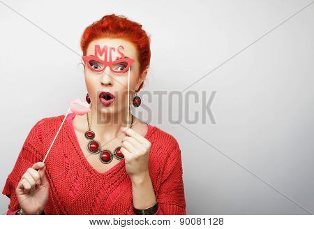 Attractive playful young woman ready for party - falce lips and glasses   
