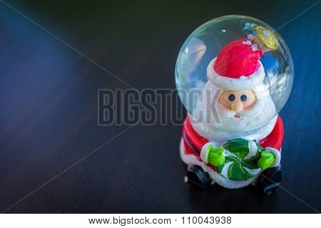 Santa Claus Water Dome Snow Glass Ball Sitting Holding Candy