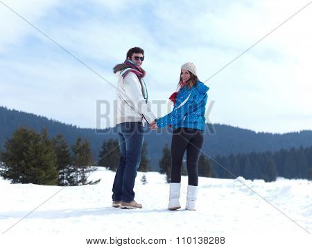 portrait of happy young romantic tourist  couple outdoor in nature at winter vacation