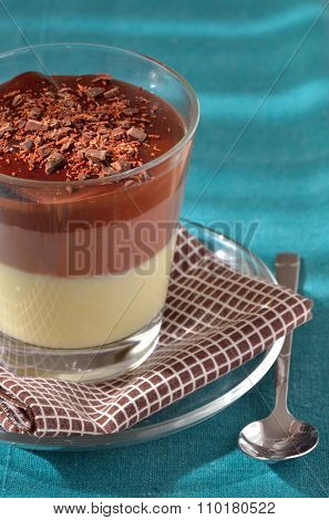 Layered chocolate dessert in glass