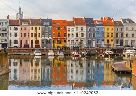 River Leie, colored houses and Belfry tower in Ghent, Belgium