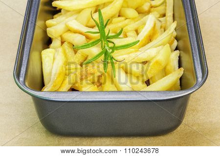Frensh fries with rosemary in dish