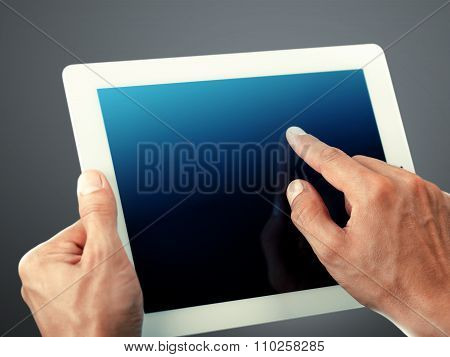 Businessman finger Pointing on touch screen digital tablet on background