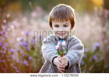 Sweet Little Boy, Holding Flowers On Sunset