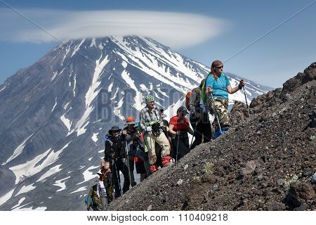 Group Of Hikers Go Hiking And Climbing To The Top Of Volcano