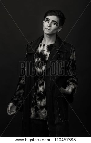 Young, handsome male actor. Actor in theatrical makeup. Emotional game male actor.