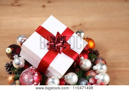 New Year gift on a golden tinsel background boly