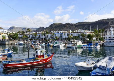 PUERTO DE MOGAN - NOVEMBER 27: View of the marina full of sailing boats in summer sunny day on 27 November 2015 in Puerto de Mogan, Gran Canaria Island.