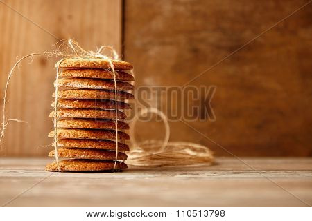 Stack Of Cookies Tied With Craft Rope On Wooden Table