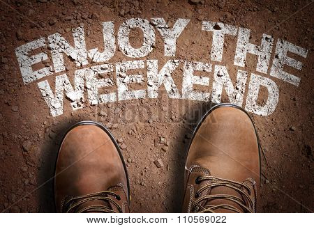 Top View of Boot on the trail with the text: Enjoy the Weeekend