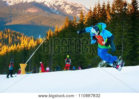 Snowboarder Jumping At Ski Resort