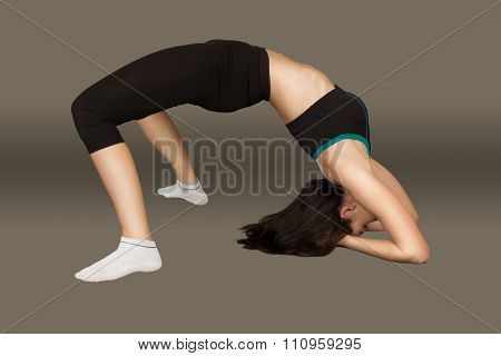 The Young Woman Carries Out Sports Exercise