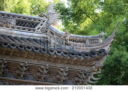 Yuyuan Garden pavilion in Shanghai showing the roof detail and decoration.
