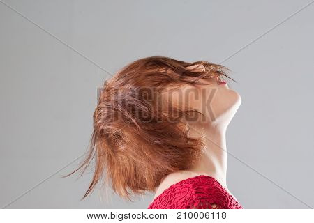 Female hairstyle advertising. Pleasant feeling. Creative woman haircut closeup on grey background with free space. Pleasure seduction erotic dreams concept