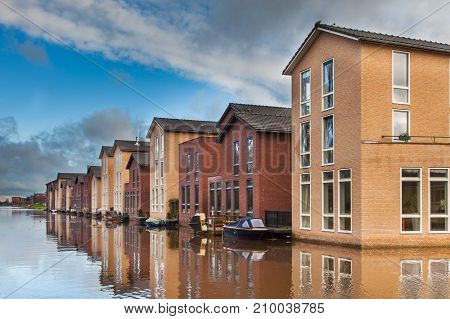 Modern Middle Class Houses Along A Canal