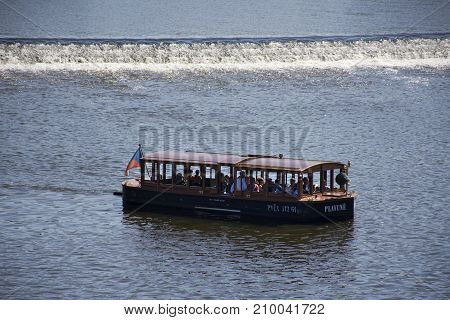 River Cruises sailing bring travelers passengers tour looking old town city at riverside of Vltava river near Charles Bridge on August 30 2017 in Prague Czech Republic