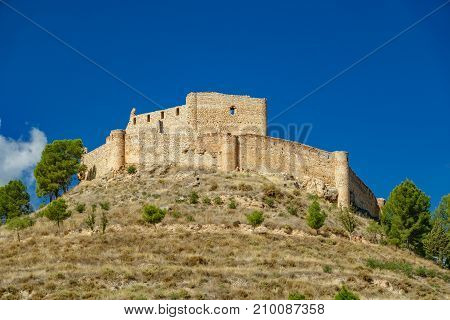 Wide angle shot of Jalance castle over hill