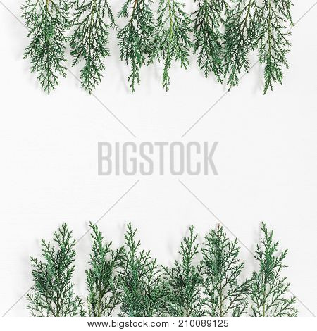 Christmas composition made of pine branches on white background. Christmas winter new year concept. Flat lay top view copy space
