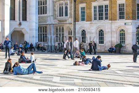People having a rest during the lunch time in the City of London.