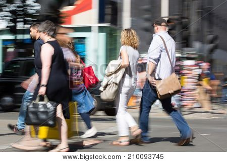 LONDON, UK - June 9, 2017: Blurred image of walking people at Oxford street, the main destination for shopping at Westend.