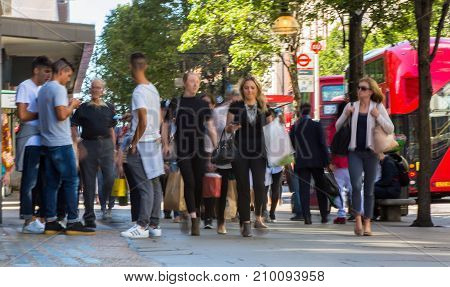 LONDON, UK - June 9, 2017: Blurred image group of walking people at Oxford street, the main destination for shopping at Westend.